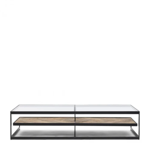 Stolik kawowy Graydon Riviera Maison o wymiarach 180x80 cm, z metalową, czarną ramą i szklanym blatem. Widoczna dolna półka z drewnianym, teksturowanym wykończeniem w jasnym odcieniu. Ujęcie frontalne, produkt leżący na jednolitym, białym tle.