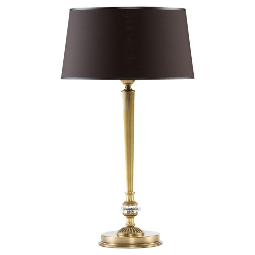 Lampa stołowa Coco o wymiarach 32x32x60 cm, z metalowym, złotym stelażem i ciemnym, okrągłym kloszem. Posiada dekoracyjne elementy szklane na podstawie. Ustawiona w pozycji stojącej na jednolitym tle.