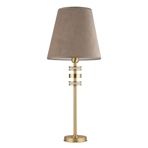 Lampa stołowa Adria II w kolorze złotym, z beżowym abażurem z materiału, o wysokości 74 cm. Posiada dekoracyjne, przezroczyste elementy metalowe. Ustawiona w pozycji stojącej, z klasycznym kształtem.