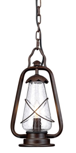 Zewnętrzna lampa wisząca Brind w brązowym kolorze, o wysokości 38 cm i średnicy 20 cm. Oferuje szklany klosz w kształcie stożka z teksturą bąbelków, otoczony metalową ramą. Produkt zawieszony na czarnej łańcuchu, widoczny w oświetleniu.