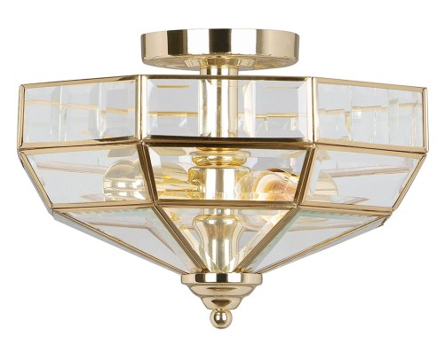 Plafon Elegance Polished w kolorze złotym, o wymiarach 32x32x23 cm. Produkt ma prostopadłościenny kształt z przezroczystymi, szklanymi elementami, osadzonymi w metalowej ramie. Ujęcie z góry pokazuje detal konstrukcji oraz stylowe wykończenie.