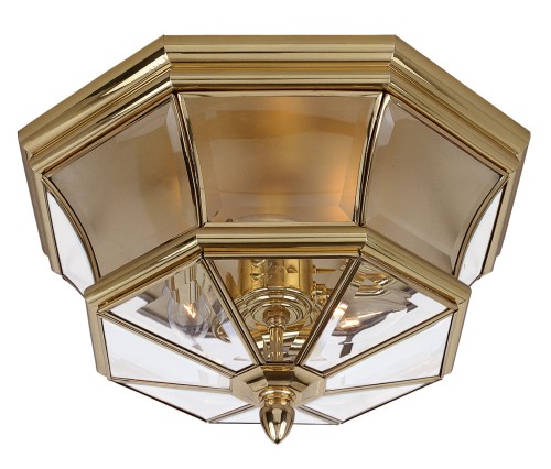 Plafon ArtDeco w kształcie ośmiokąta, wykonany z mosiądzu, w kolorze złotym. Przezroczyste wstawki z tworzywa sztucznego, z widocznymi źródłami światła wewnątrz. Ujęcie frontalne, montowany na suficie, z eleganckim detalem na spodzie.