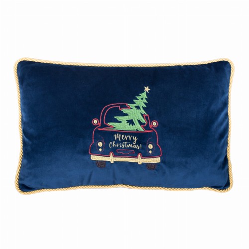 Granatowa prostokątna poduszka z miękkiego błyszczącego materiału, haft z czerwoną ciężarówką, choinką i napisem Merry Christmas!, wykończona złotą lamówką, stoi na płaskiej powierzchni.