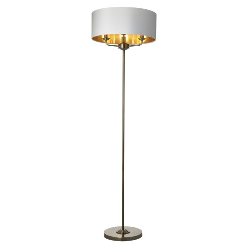 Lampa podłogowa Highclere, 160 cm, metalowy stelaż mosiężny, biały okrągły klosz ze złotą powłoką wewnątrz, na okrągłej podstawie, białe tło, frontalne ujęcie.