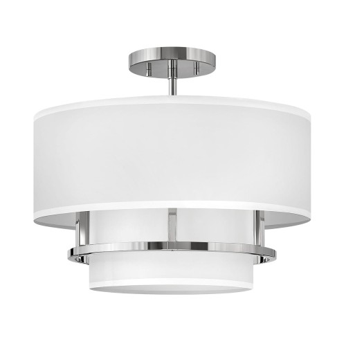 Nowoczesna lampa wisząca w kolorze polerowanego niklu z białym abażurem w kształcie cylindrycznym. Ujęcie z przodu, zawieszona pod sufitem, z widoczną metalową podstawą. Lampa ma dekoracyjne elementy oraz elegancki design do nowoczesnych wnętrz.