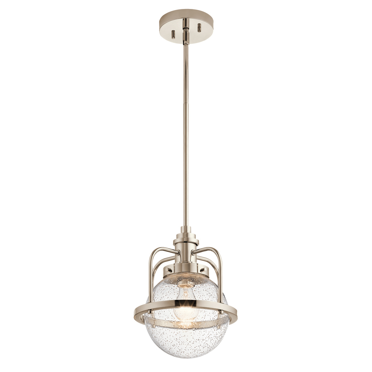 Lampa wisząca Triocent w kolorze polerowanego niklu, z przezroczystym kloszem o chropowatej fakturze. Produkt zawieszony na cienkim drążku. Widoczny detal montażowy oraz źródło światła wewnątrz klosza. Tło proste, białe.