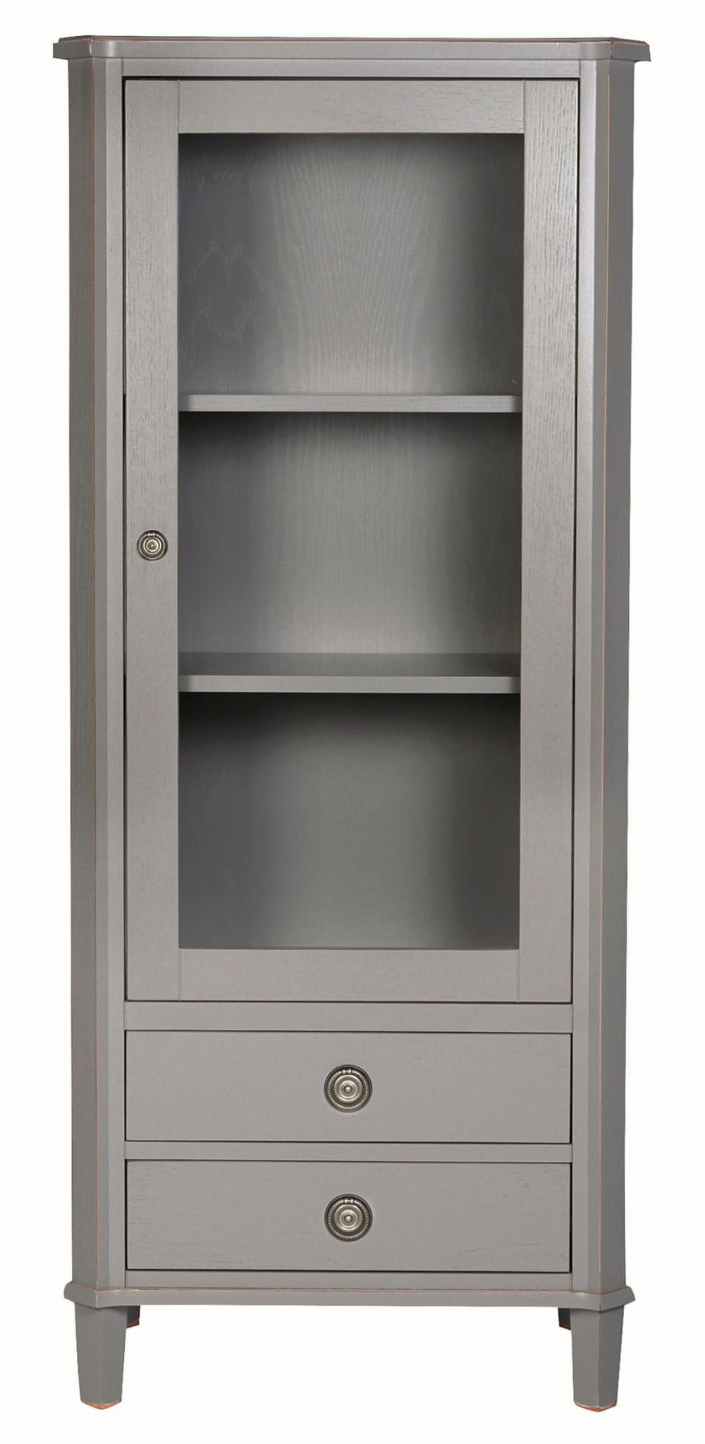 Elegancka witryna w kolorze szarym z dwoma szufladami i przeszklonymi drzwiami. Produkt stoi w pozycji pionowej, ukazując trzy półki wewnętrzne. Detale obejmują okrągłe, metalowe uchwyty szuflad oraz subtelne wykończenie boków.